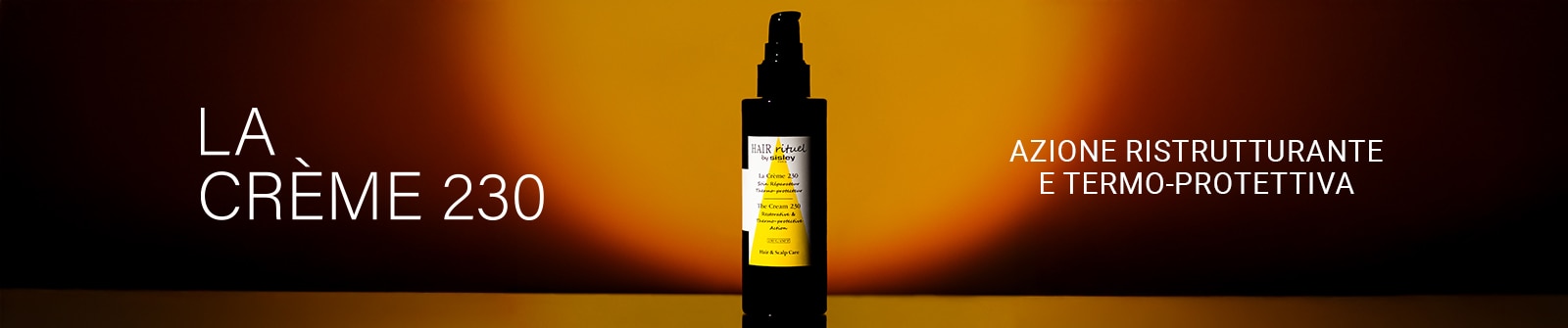 La Crème 230 Hair Rituel by Sisley trattamento ristrutturante e termo-protettivo, flacone nero con etichetta gialla su sfondo arancione luminoso.